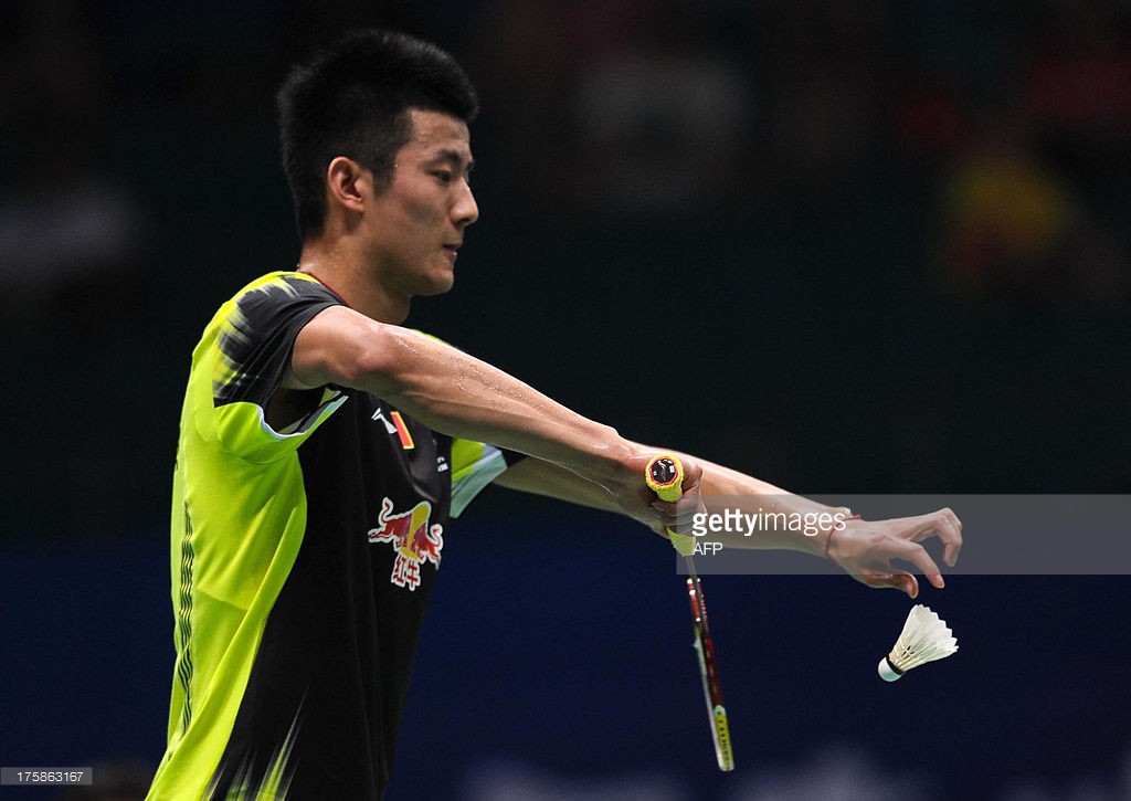 China's Chen Long makes a serve...