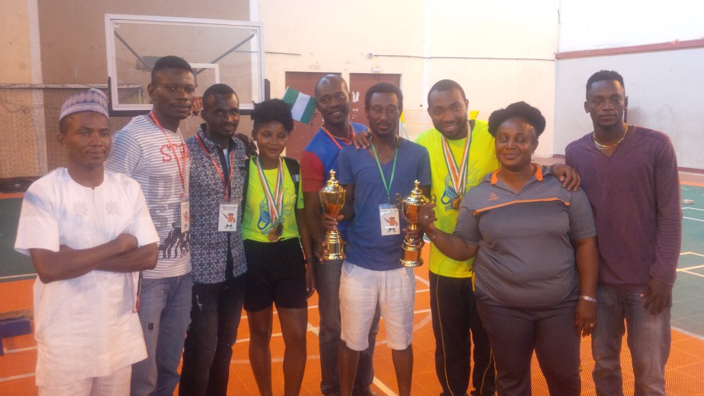 Group of Nigerian players and coaches after triumph
